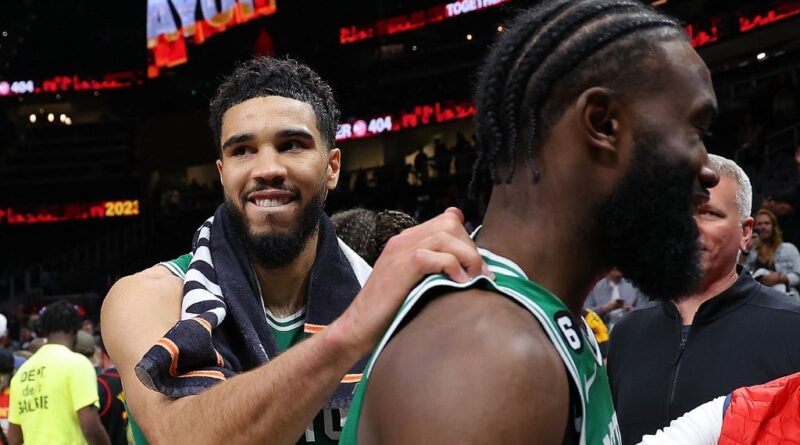 Jayson Tatum #0 of the Boston Celtics celebrates their 128-120 win over the Atlanta Hawks with Jaylen Brown #7 after Game Six of the Eastern Conference First Round Playoffs at State Farm Arena on April 27, 2023 in Atlanta, Georgia.