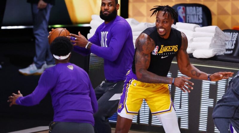 LeBron James #23 of the Los Angeles Lakers and Dwight Howard #39 of the Los Angeles Lakers warms-up prior to the start of the game against the Miami Heat in Game One of the 2020 NBA Finals at AdventHealth Arena at the ESPN Wide World Of Sports Complex on September 30, 2020 in Lake Buena Vista, Florida.