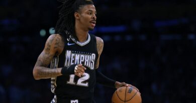 Ja Morant #12 of the Memphis Grizzlies brings the ball up court during a 111-101 Los Angeles Lakers win in Game Three of the Western Conference First Round Playoffs at Crypto.com Arena on April 22, 2023 in Los Angeles, California.