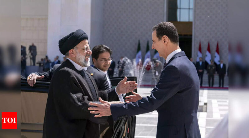 Iran's president Raisi holds rare meeting with Assad in Syria - Times of India