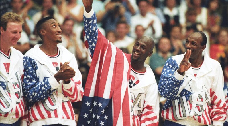 FILE PHOTO: U.S. basketball player Michael Jordan (2nd R) flashes a victory sign as he stands with team mates Larry Bird (L), Scottie Pippen and Clyde Drexler (R), nicknamed the "Dream Team" after winning the Olympic gold in Barcelona, Spain on August 8, 1992.