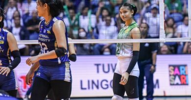 Angel Canino cheekily smiles at her opponents during Game 1 of the UAAP women