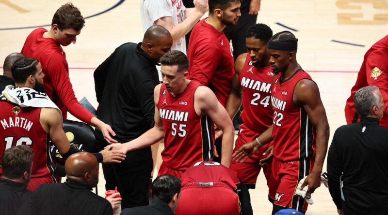 Miami Heat players react during a timeout during the second quarter against the Denver Nuggets in Game One of the 2023 NBA Finals at Ball Arena on June 01, 2023 in Denver, Colorado.