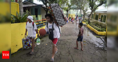 Rains unleashed by typhoon worry thousands of people fleeing restive Philippine volcano - Times of India