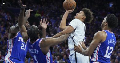 Cameron Johnson #2 of the Brooklyn Nets shoots the ball against Joel Embiid #21, James Harden #1, and Tobias Harris #12 of the Philadelphia 76ers in the fourth quarter during Game Two of the Eastern Conference First Round Playoffs at the Wells Fargo Center on April 17, 2023 in Philadelphia, Pennsylvania.