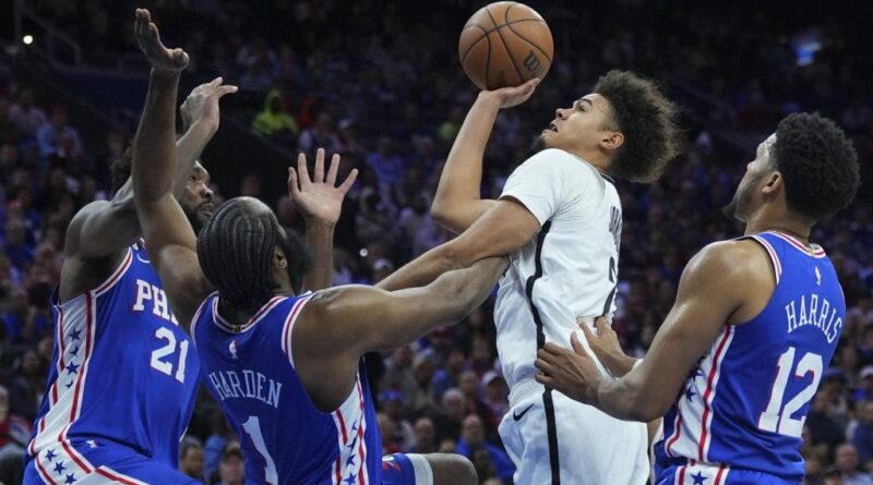 Cameron Johnson #2 of the Brooklyn Nets shoots the ball against Joel Embiid #21, James Harden #1, and Tobias Harris #12 of the Philadelphia 76ers in the fourth quarter during Game Two of the Eastern Conference First Round Playoffs at the Wells Fargo Center on April 17, 2023 in Philadelphia, Pennsylvania.