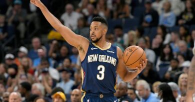 New Orleans Pelicans guard CJ McCollum handles the ball during the first half of the team